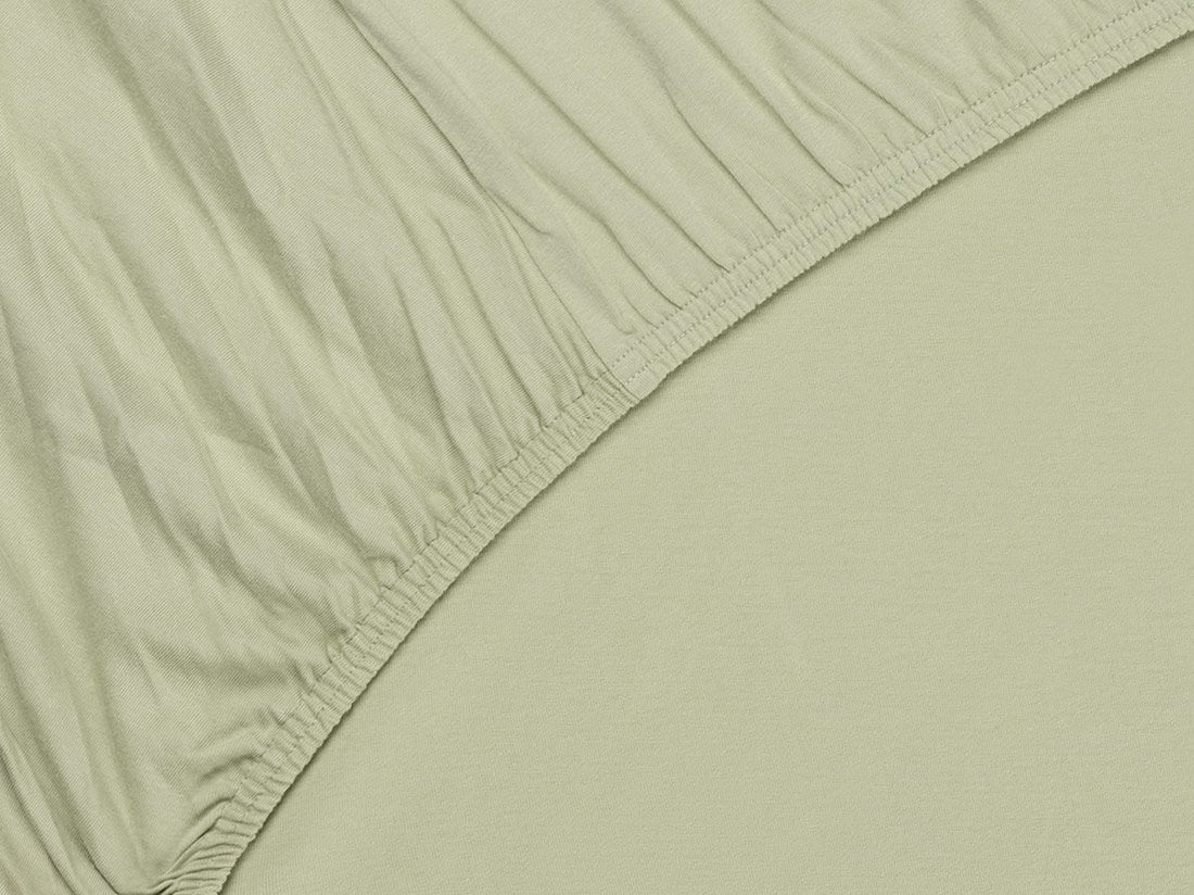 Dra på-lakan jersey pistachio green