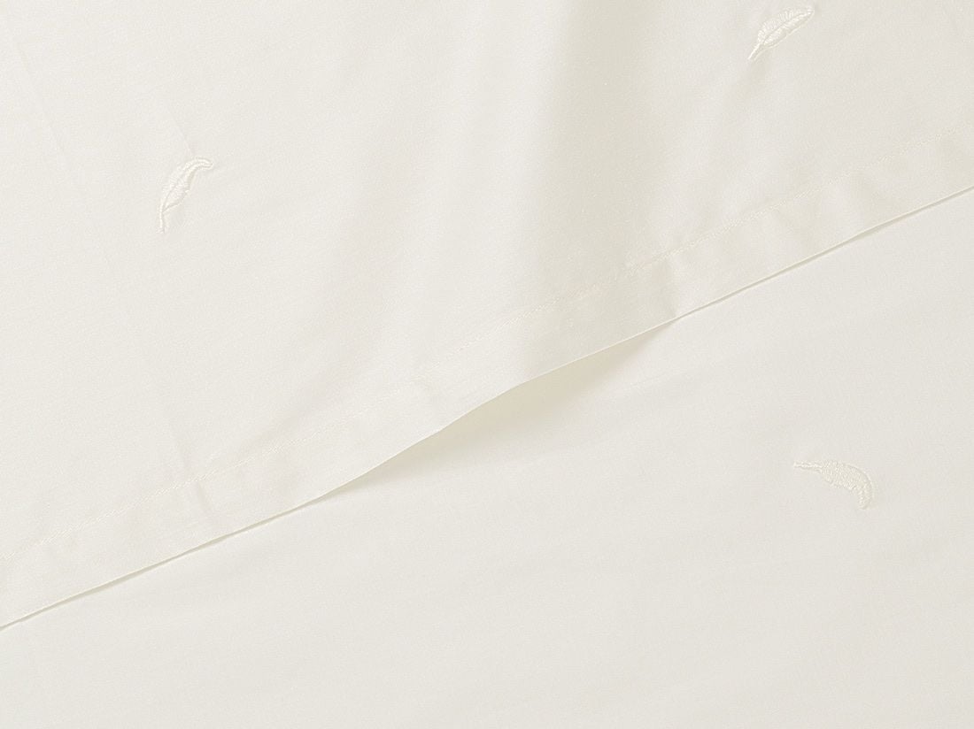 Barnlakan bomullssatin warm white feather