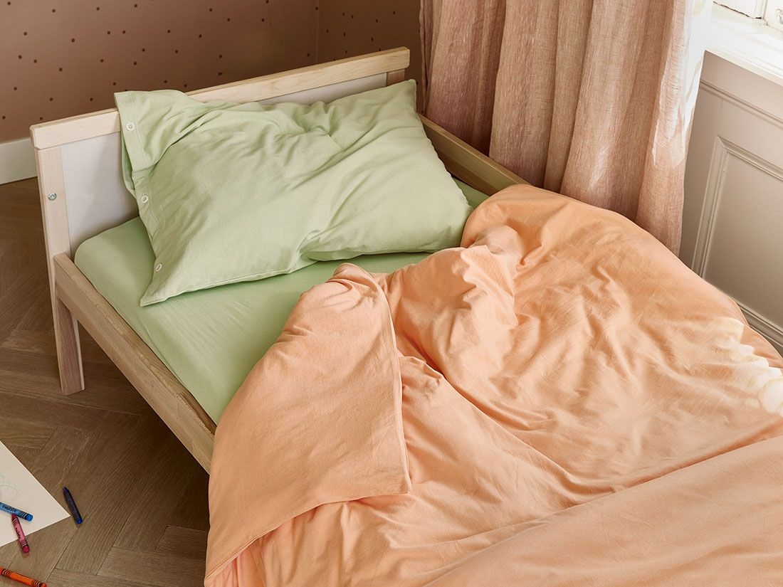 Dra på-lakan för barn jersey pistachio green
