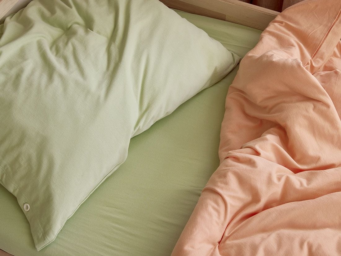 Dra på-lakan jersey pistachio green