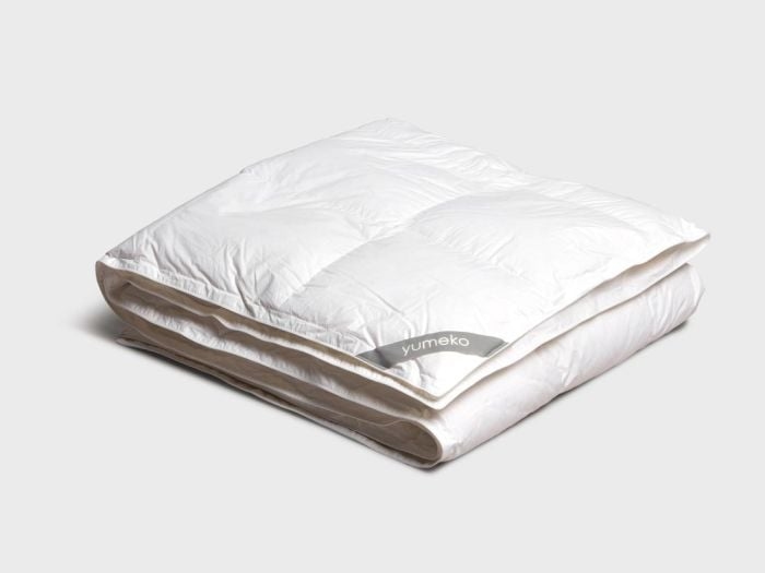 Täcke av återvunnen dun vinter